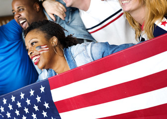 Friends cheering world cup with painted flag