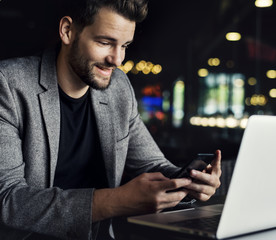 Man reading messages on his phone
