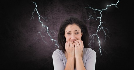 Wall Mural - Lightning strikes and scared afraid woman biting nails