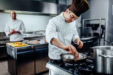 Placing a nice piece of meat on the pan