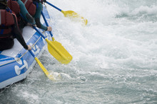 Close Up Of A Team Of People Rafting On Whitewater Rapids