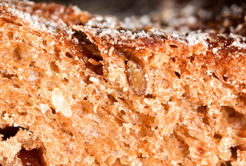 Bread with seeds and raisins as a background