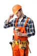 © LIGHTFIELD STUDIOS - Repairman in orange overall and helmet holding coffee cup isolated on white