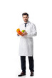 © LIGHTFIELD STUDIOS - nutritionist in white coat with fresh vegetables and apple in hands isolated on white