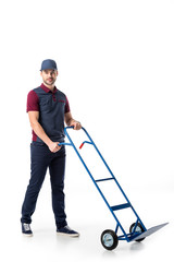 Sticker - delivery man in uniform with empty hand truck isolated on white