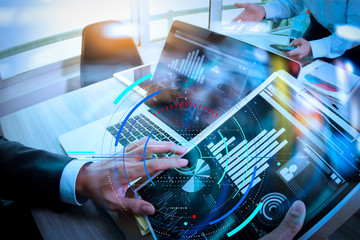 Poster - Businessman making presentation with his colleagues and business tablet digital computer at the office as concept