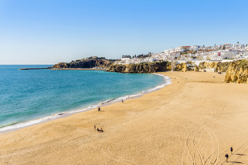 Wall Mural - Amazingly wide, almost empty Fishermen Beach in Albufeira, Algarve, Portugal