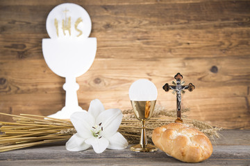 Eucharist symbol of bread and wine, chalice and host, First communion background