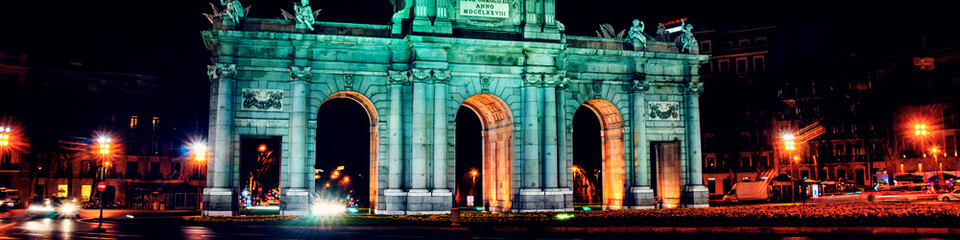 Canvas Print - Night view of The Puerta de Alcala at night - a monument in the Independence Square in Madrid, Spain