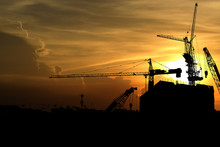 Silhouette Crane Construction Building At Sunset