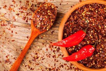 Wall Mural - red pepper or cayenne pepper crushed with flakes scattered 