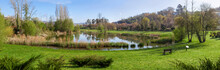 Parque Da Devesa Urban Park In Vila Nova De Famalicao, Portugal. Built Near The Center Of The City. View Of The Green Grass Lawns And Lake Or Pond