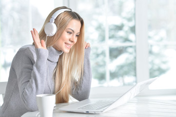  woman using  at laptop