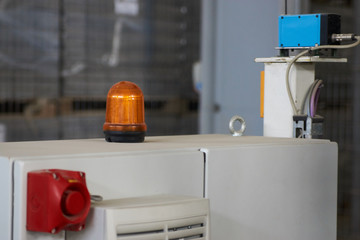 Warning light alarm for machine working. Emergency lighting in the factory, close-up. Warning light, Orange siren, Alarm equipment