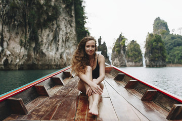 Wall Mural - Beautiful woman posing on a boat