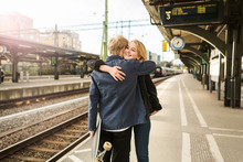 Couple Hugging At Train Station