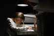 © Maskot - Girl doing homework
