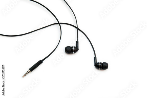 Valokuva Black headphones for listening to music and sound on portable devices: music player, smartphone, laptop and jack for connection on a white background