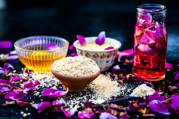 Ayurvedic ubtan of Rose water,gram flour,oats and rose petals or face pack on wooden surface helps in removing pimples,dead skin and smooth  the dried skin and give a moisture.