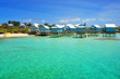 Beautiful tropical beach on Bermuda Island and houses on stilts