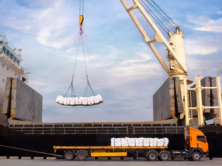 Sticker - Sugar bags are loading in hold of bulk-vessel at industrial port,Pick up sugar bags from truck to  loading on board.