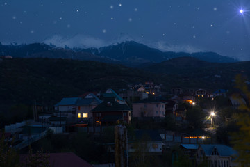 Wall Mural - Snowy mountains view, over spring Almaty city. Kazakhstan.