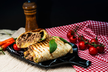 Wall Mural - beef tacos served with lettuce and fresh tomatoes