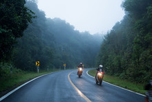 Motorcycle On Foggy Road In Mystery Land