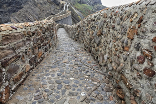 241 stone steps climb to Gaztelugatxe islet top-San Juan hermitage Poster