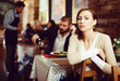 © JackF - quarreled visitors female and male in restaurant