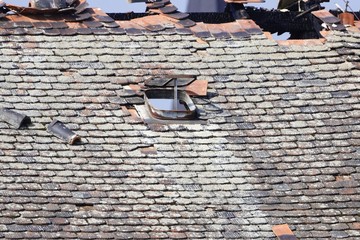 Window and roof of an destroyed house.