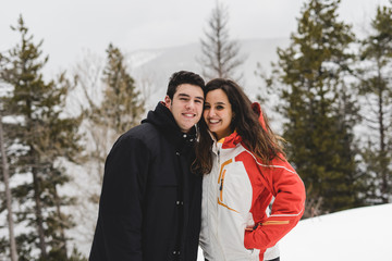 Couple kiss in snowy landscape