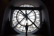 Girl silhouette standing in front of vintage clock tower with roman numbers. Paris Orsay Museum.