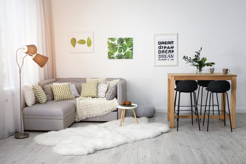 Wall Mural - Beautiful room interior with comfortable sofa and stylish table