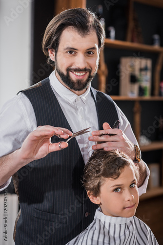Adorable Little Kid Getting Haircut From Handsome Smiling