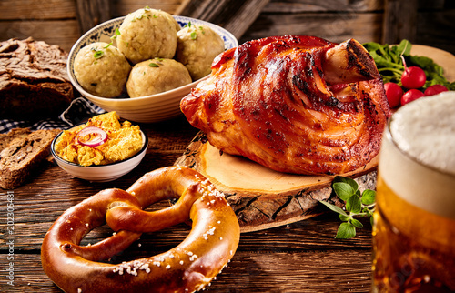 Fotografie, Obraz Roasted ham hock, pretzel, cheese spread with beer