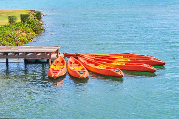 Wall Mural - Colorful kayaks on the tropical beach