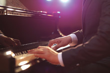 Close-up Of A Piano Player