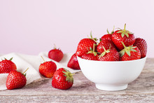 Strawberry In A White Bowl On A Table