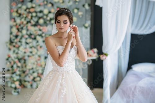 A Sweet Young Bride On Wedding Day Is Going And Putting On