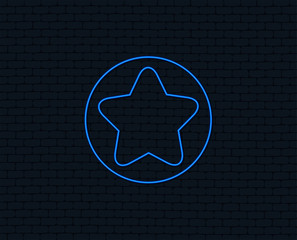 Neon light. Star sign icon. Favorite button. Navigation symbol. Glowing graphic design. Brick wall. Vector