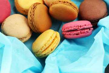 Different types of macaroons or macarons in a box