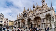 Timelapse Of Campanile Di San Marco And Palazzo Ducale Doge's Palace In Venice, Italy. Columns Of San Marco And San Todaro. Blue Cloudy Sky At 4K