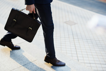 Man carrying his bag to work