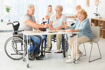 Canvas Print - Senior people playing lotto at care home