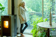 © PhotoAlto - Mature woman talking on cell phone at home
