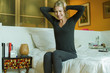 © PhotoAlto - Mature woman holding hands on head in anquish