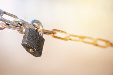 Metal Lock With Chain On Blurred Sunny Background