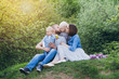 © irina_timokhina - Family with two children rest in the summer garden