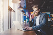 © Vasyl - Young man is working in modern office